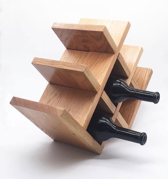 This is a 8 bottle wine stand, made out of oak. The pieces are modular so it fits into perfectly in your kitchen, or any other table top in your house. 