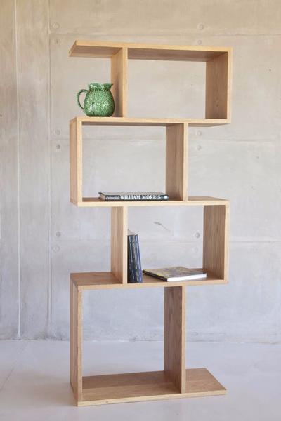 This is one of our modern shelves made from oak and sealed with wax. It has 4 cubes, stacked vertically. Ideal for ornaments and books. 