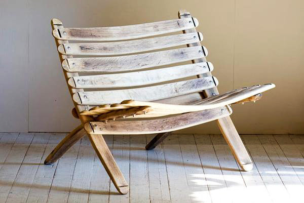 This is a loveseat, made from reclaimed oak barrels.
