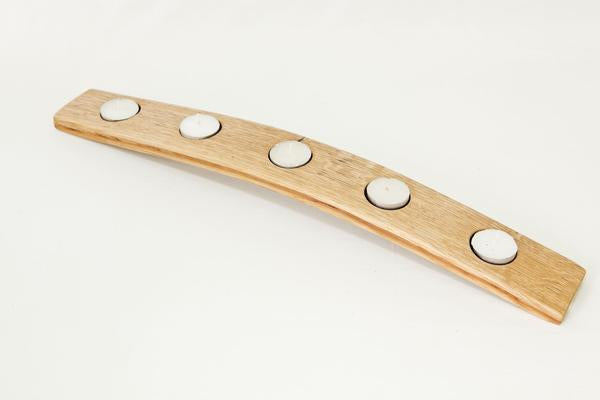 This is a short-wooden-tea-light-holder with 5 tea light candles included, made from a recovered oak barrels.