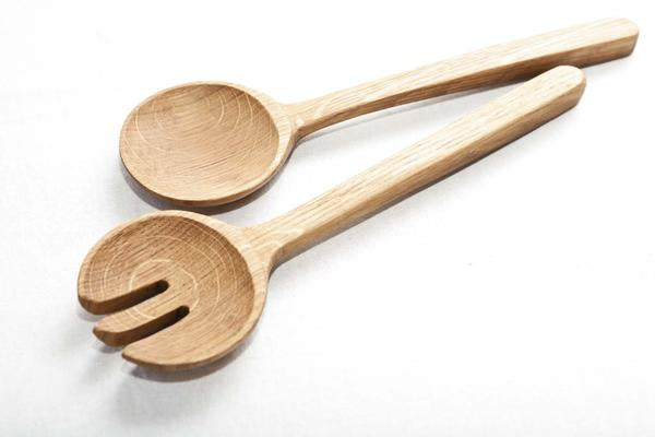 This is a pair of wooden salad servers made from recycled oak.