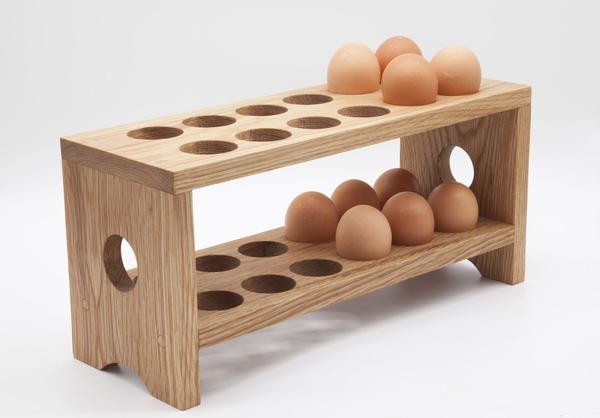 This is an egg tray made from solid wood holding 10 eggs. It can hold 24 eggs at its maximum capacity and is sealed with a polywax sealer for extra protection. 