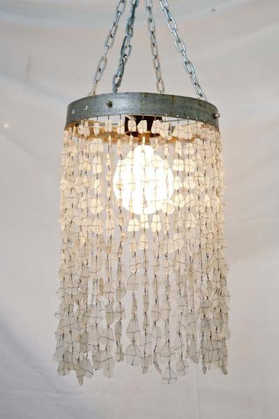 This is a chandelier made with 500 glass beads, and the hoop is made from galvanised steel from an old wine barrel. 