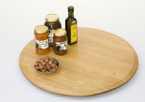 This is a lazy susan with condiments. This wooden turntable is made from recycled oak barrels.  