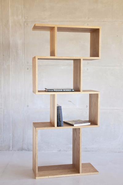 This is one of our modern shelves made from oak and sealed with wax, or natural white oil. It has 4 cubes, stacked vertically. Ideal for stacking coffee table books. 