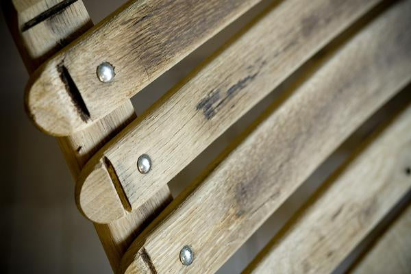 This is a close up of the reclining back of the loveseat, made from oak barrels.