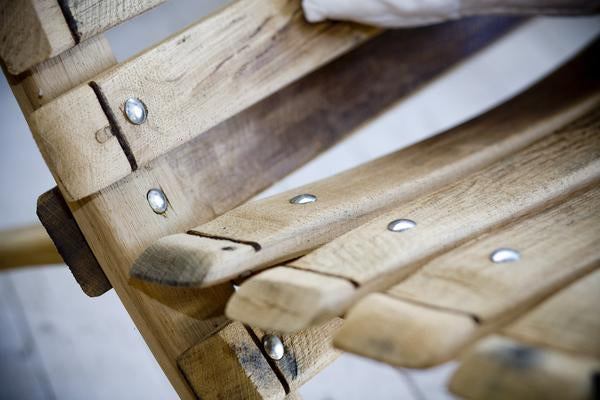 This is a close up of the reclining loveseat, detailing the reclaimed oak barrel staves. 