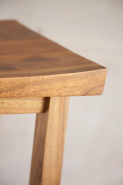 This is a close up of the edge corner of a bar chair. These bar chairs are made from blackwood. The height can be customised to fit into most spaces, including kitchens. 