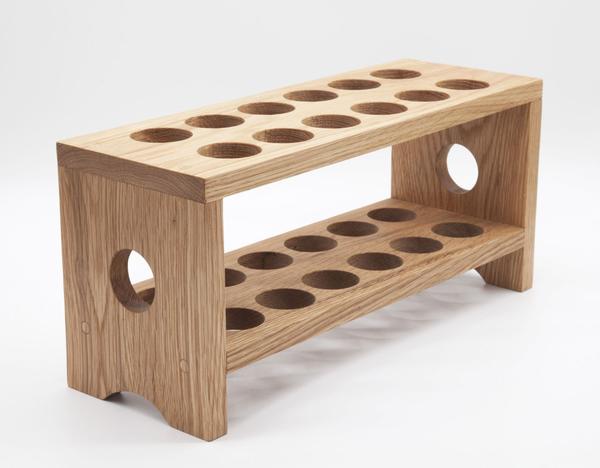 This is a wooden egg carton, or tray made from solid wood. It can hold a maximum of 24 eggs. 