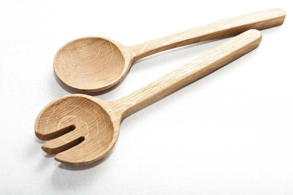 This is a pair of wooden salad servers made from recycled oak. 