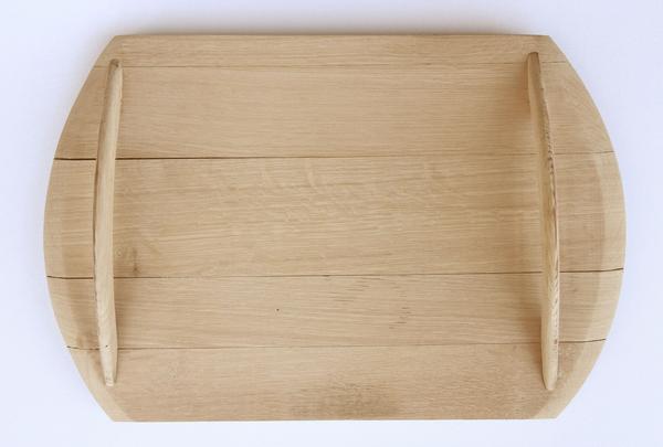 This is a wooden serving tray made from oak barrels. It has wooden handles. 
